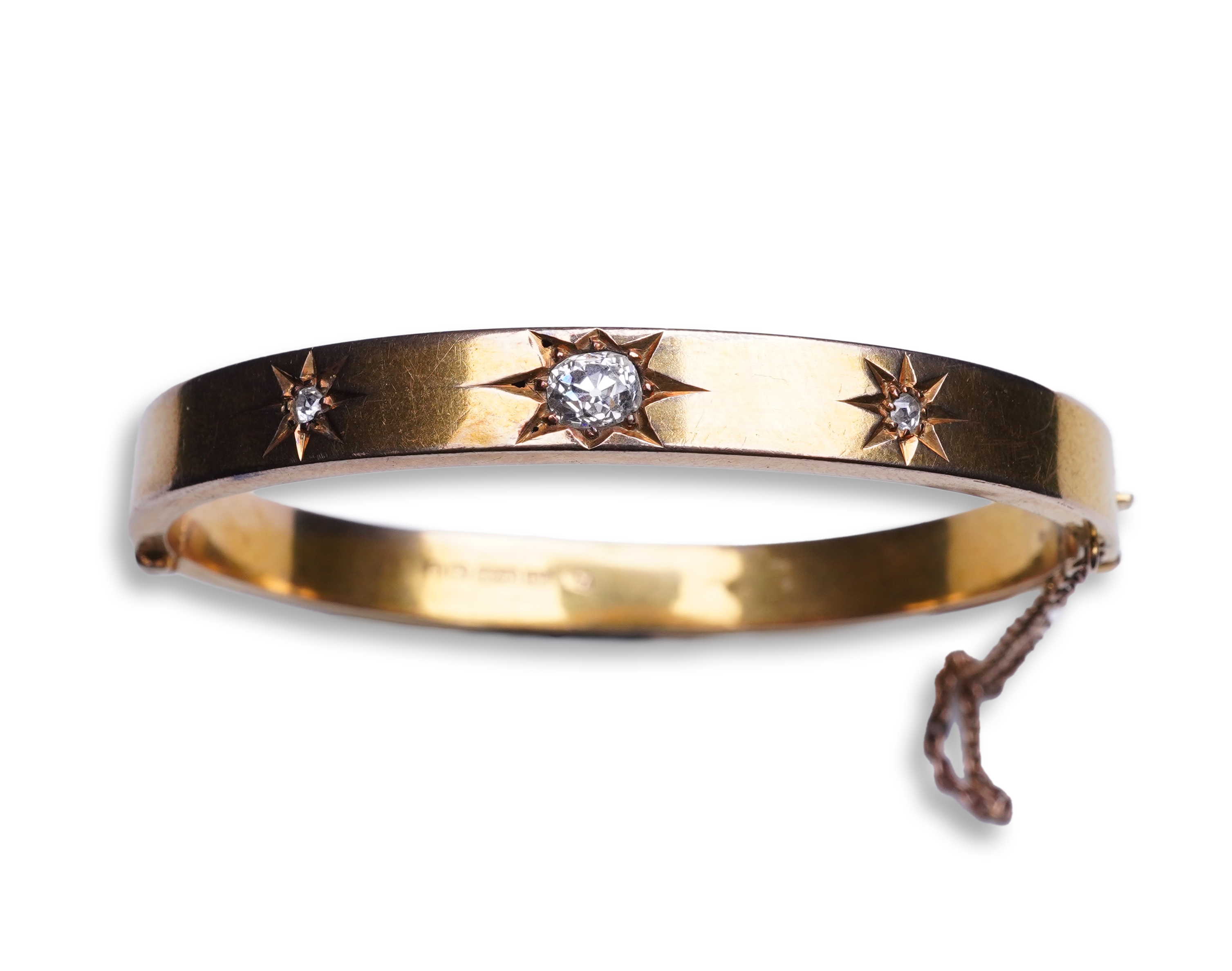 An Edwardian 15ct gold and diamond bangle, circa 1904